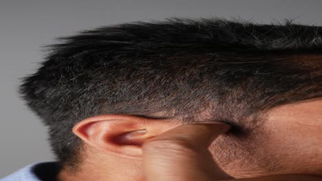 close up of a man's ear and side of face