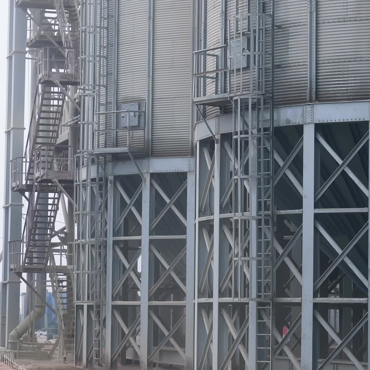 Large-sized grain storage elevator. Metal industrial silos for agribusiness
