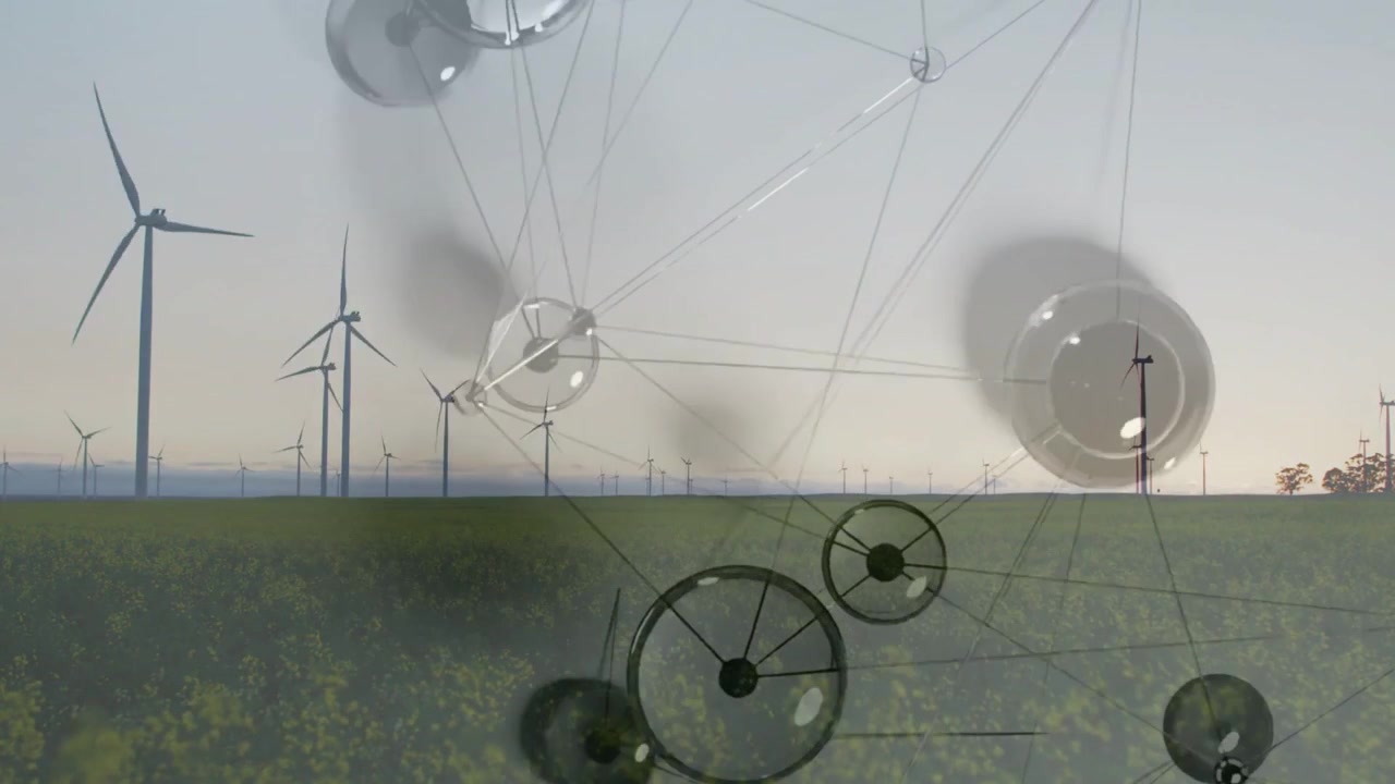 Riproduzione di una rete che si estende su un parco eolico e un campo di colza, con nodi rotanti che mostrano energia.