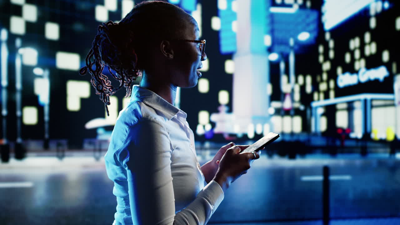 Cheerful woman texts and walks in city