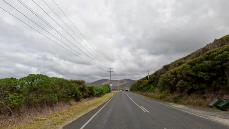 a 35-second video captures a drive along the great ocean road, showcasing coastal landscapes and lush greenery under overcast skies