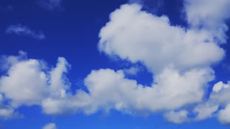 a sky with sparse clouds during the daylight hours