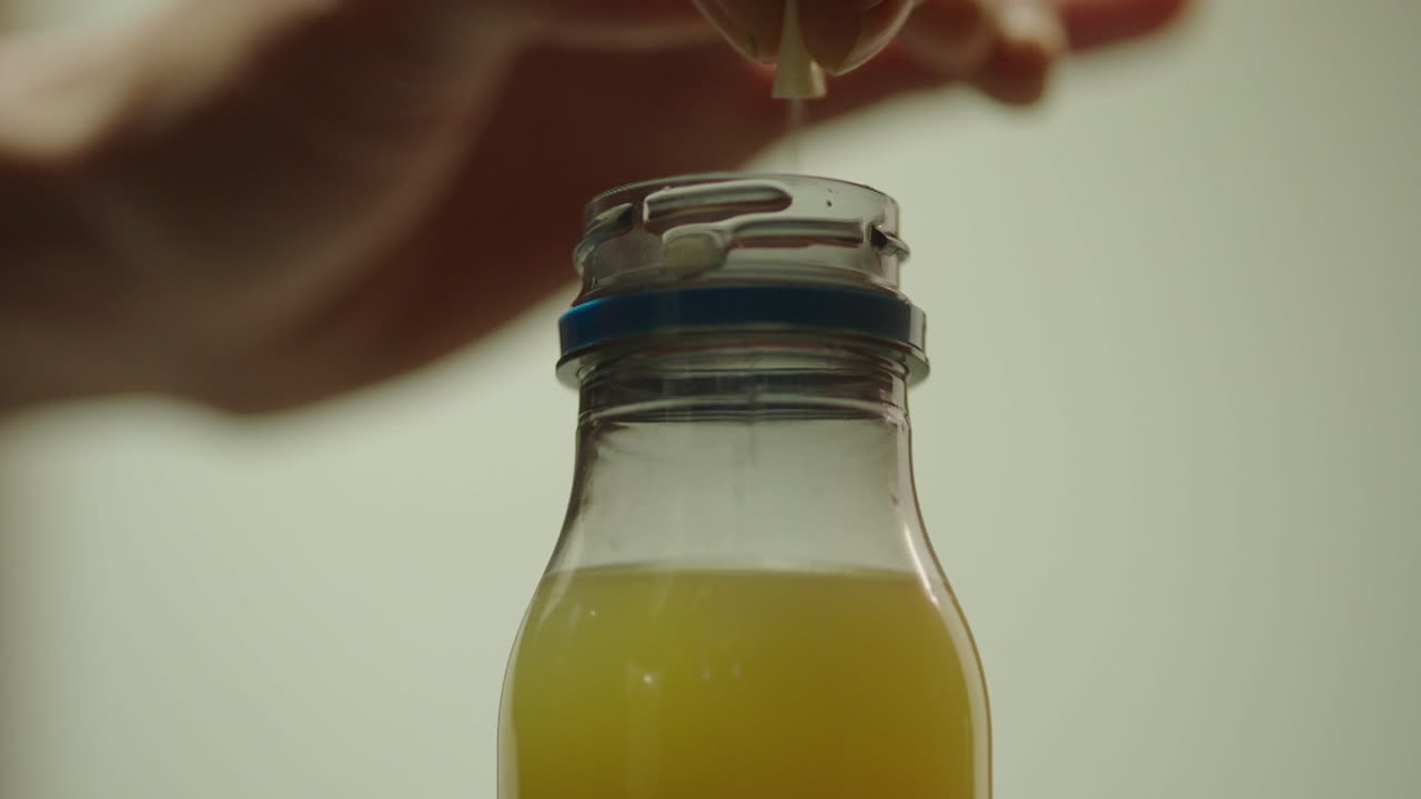 Pouring liquid into a bottle