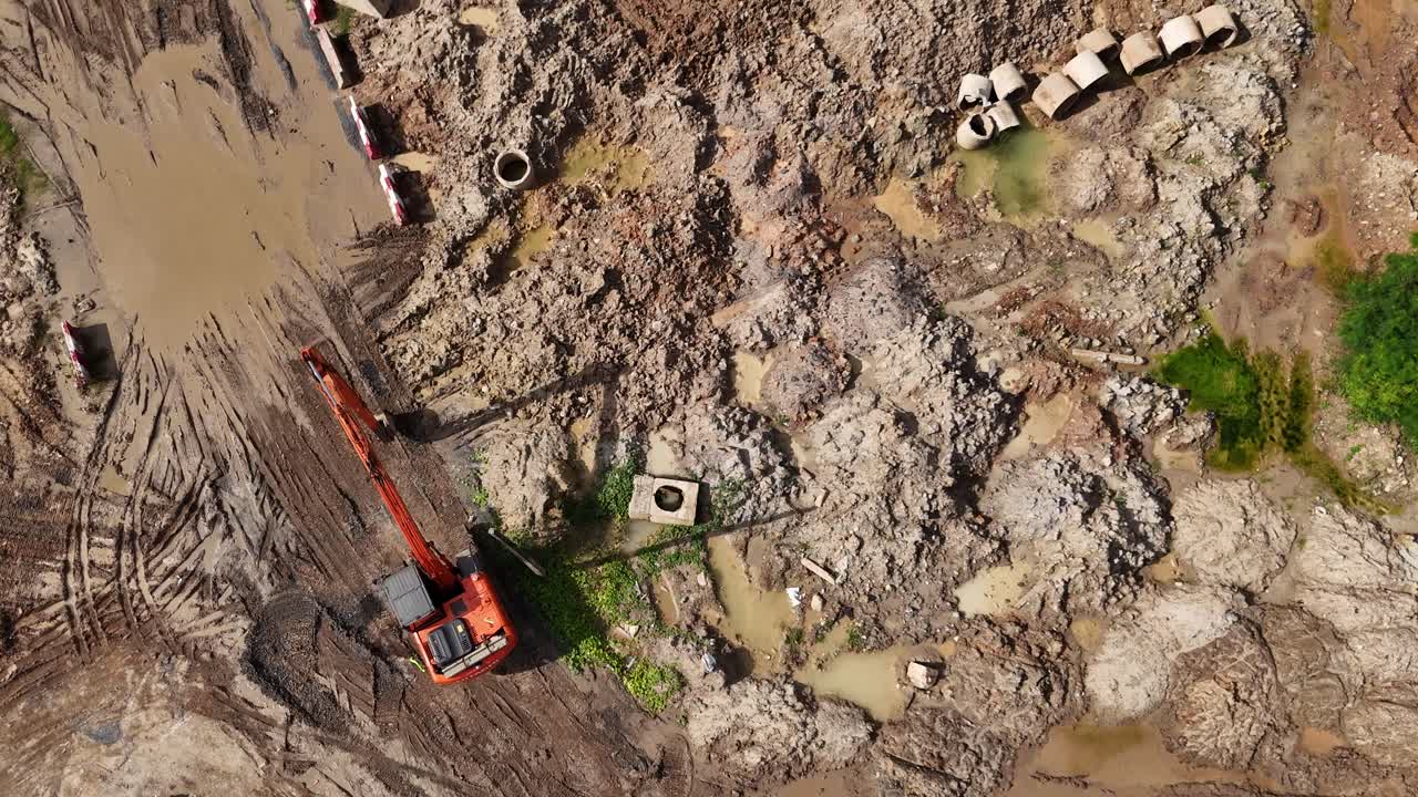 Aerial view of construction site with excavator