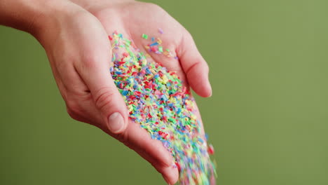 recycled plastic pieces in hands