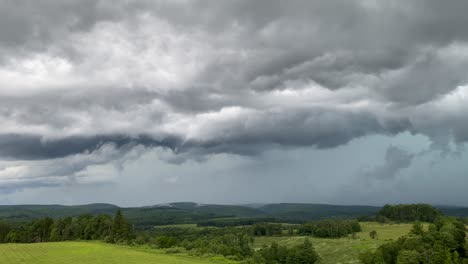 a violent thunderstorm rolling over the hills in elk county, pennsylvania