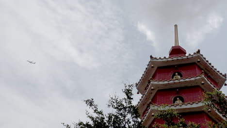 red pagoda on a temple in china - tilt up shot