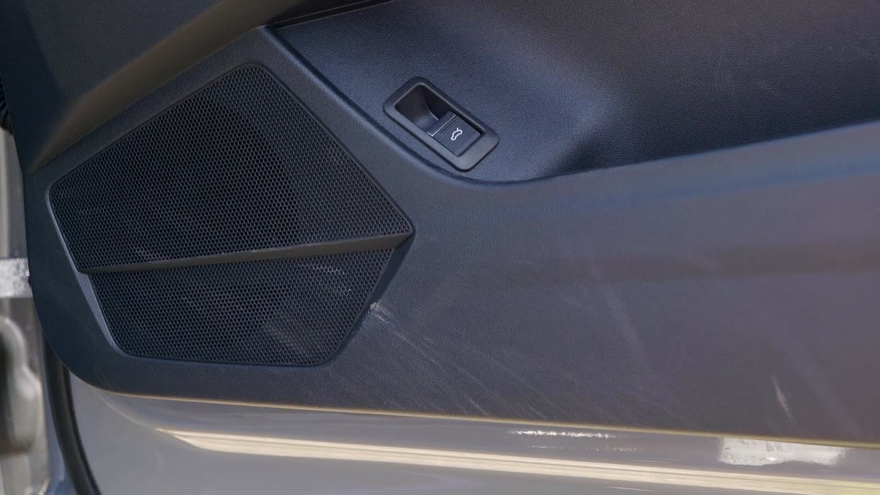 Spraying cleaning product on to interior plastic door trim