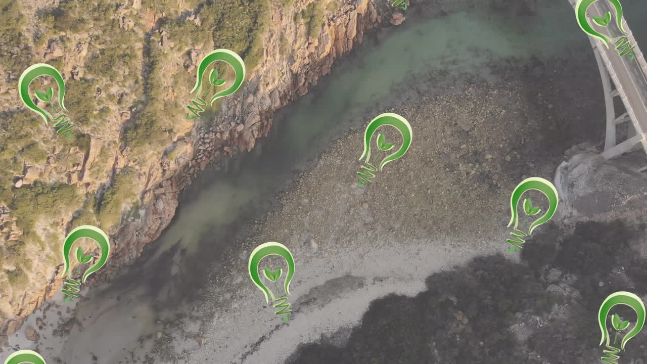 녹색 전구, 지속 가능성 및 생태학 아이콘을 풍경 위에 애니메이션