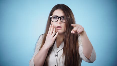 shocked and surprised woman pointing