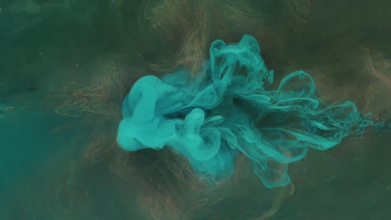 color fluid mix smoke cloud motion orange blue ink