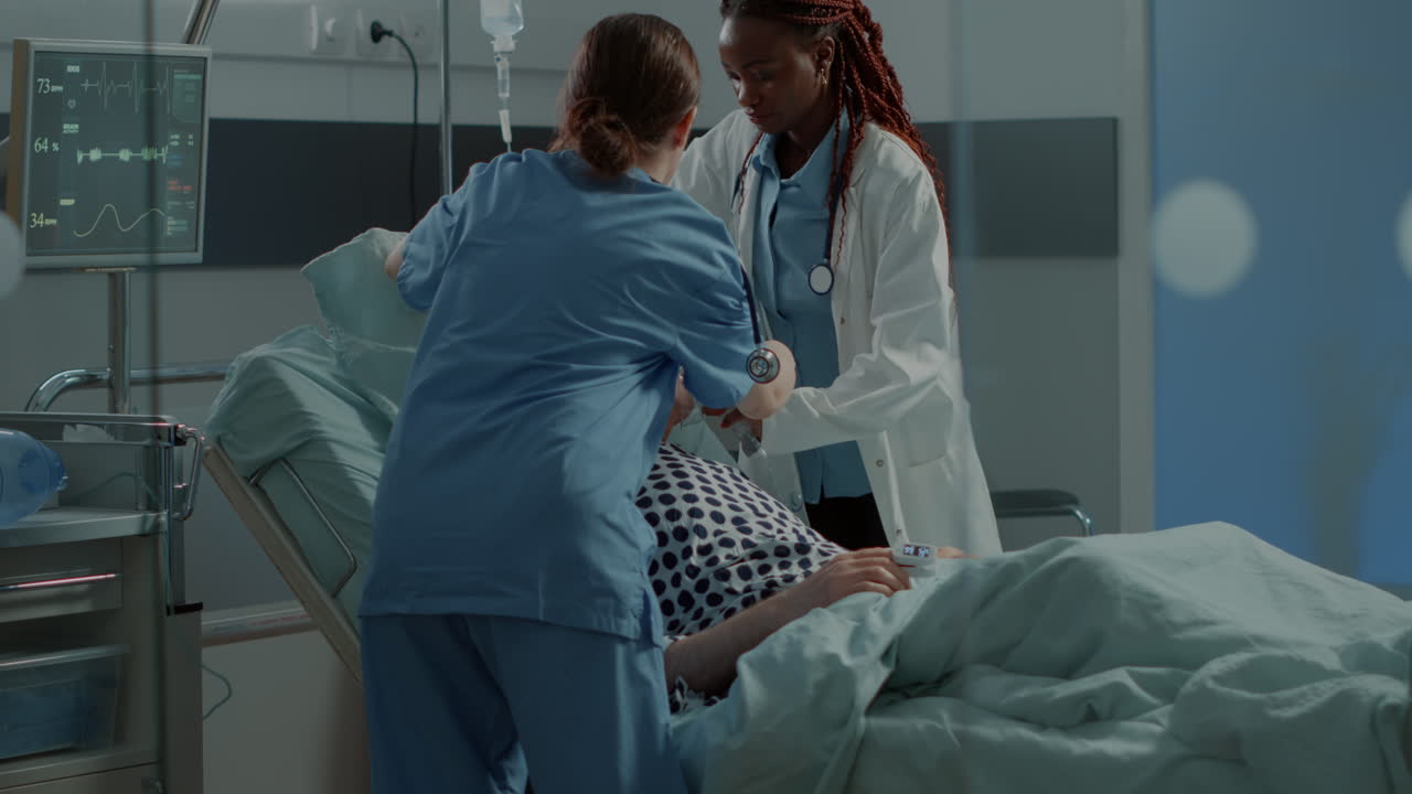 Multi ethnic medical staff running to help ill patient