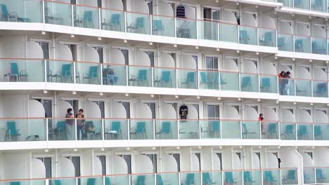 people on cruise ship balconies during pandemic