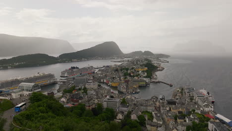 cruise ships docked at scenic tourist town of alesund in norway