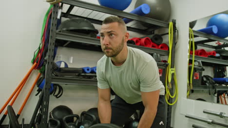 muscular man actively training in the modern gym