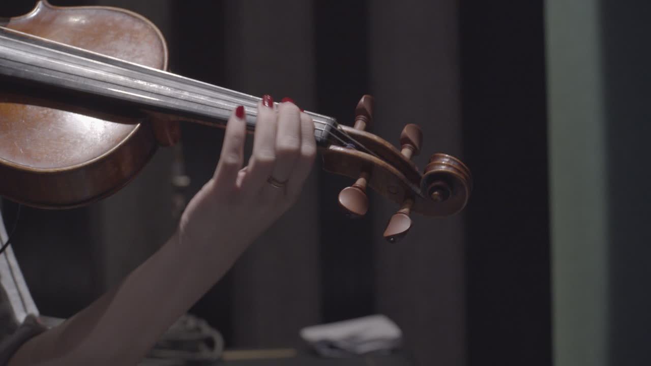 Woman Playing Violin Close Up