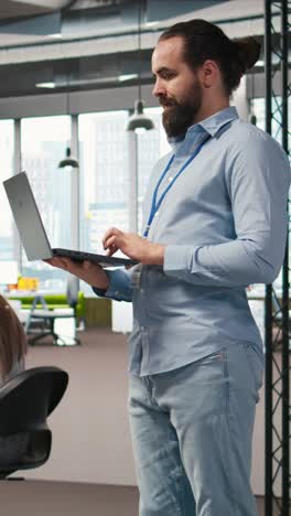 vertical video team of programmers in office developing software applications using ai