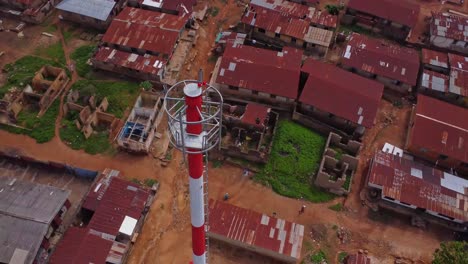beautiful aerial of the top of a telecommunication tower in a small, rural village in nigeria, africa. radio tower built within local community in the city of ibadan.