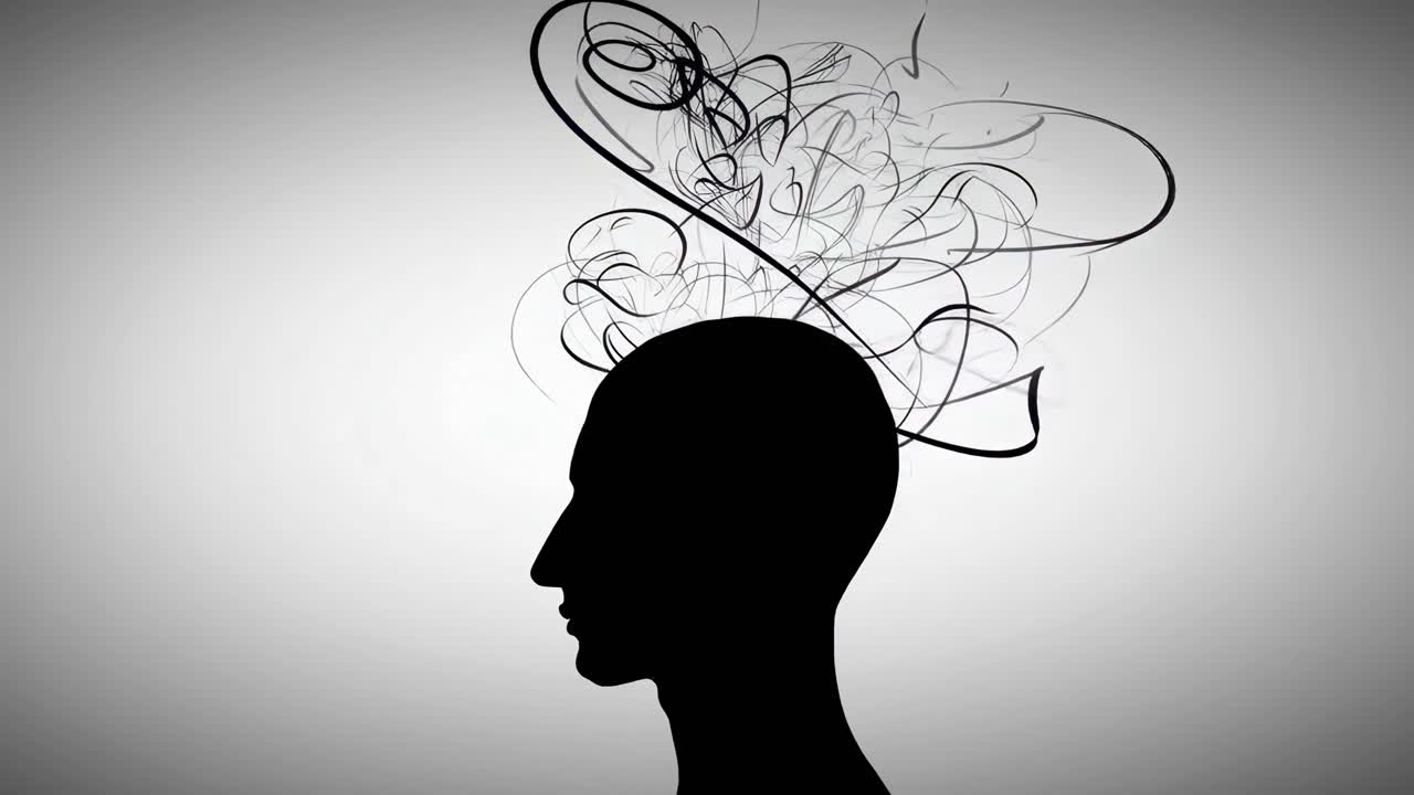 Silhouette of a head with swirling lines, side angle. Conceptual video of thoughts. Live desktop