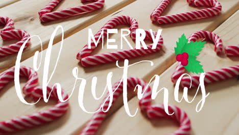 animation of merry christmas text over christmas candy canes