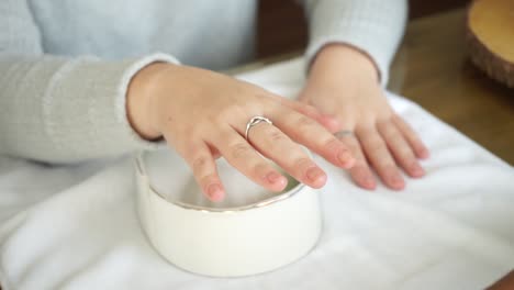 Caucasian-woman-gets-a-hand-massage