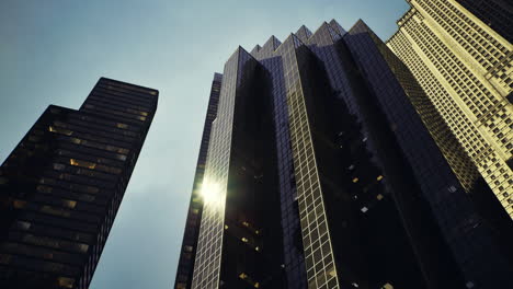 modern skyscrapers reach towards the sky in an urban landscape at sunset
