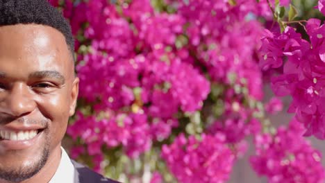 Portrait-of-happy-african-american-man-looking-at-camera-and-smiling,-copy-space,-slow-motion