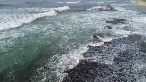 aerial view. aerial drone footage of ocean waves breaking