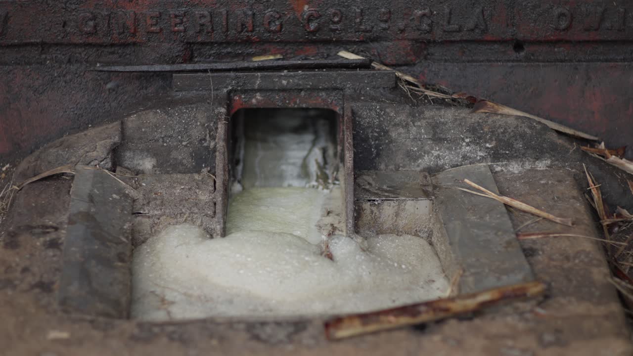 Close-up view of old sugarcane processing machinery