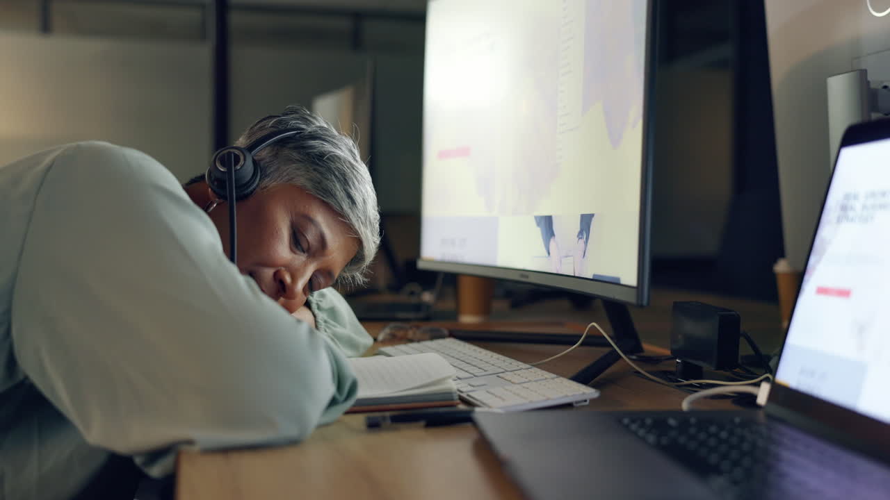Tired Employee Taking a Nap at Night in the Office
