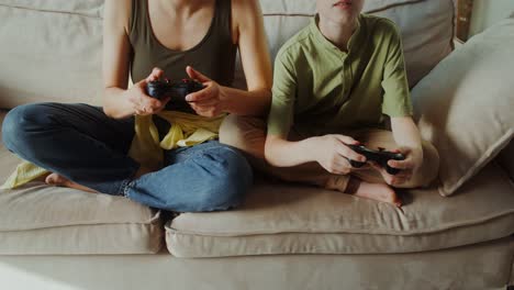 mother and son playing video games together