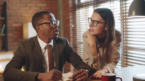 multiethnic colleagues discussing business on video call