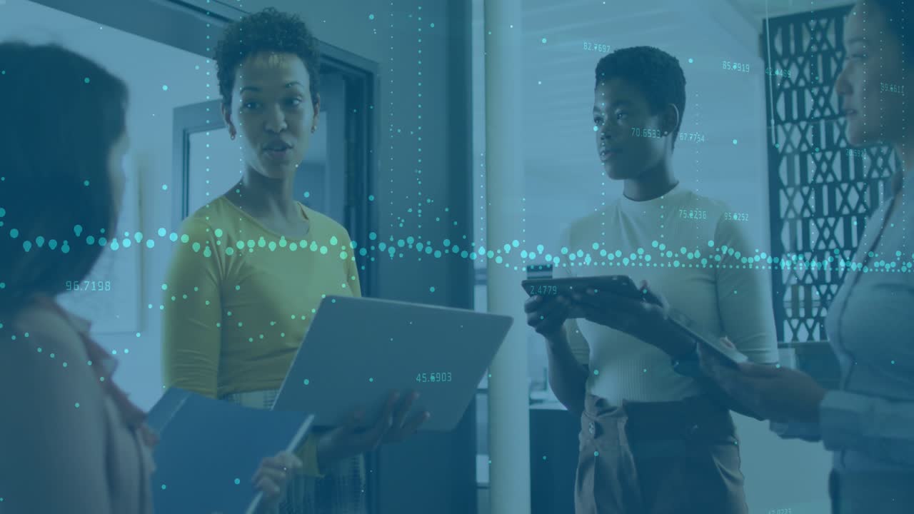 Animation of graph over diverse female coworkers standing and sharing ideas in office