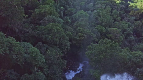 Aerial-shot-of-waterfall-flying-over-crest-and-into-the-fall,-Meseta-de-Chorcha,-Chiriqui,-Panama