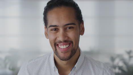 close-up-portrait-attractive-young-hispanic-entrepreneur-man-laughing-enjoying-professional-career-success-slow-motion