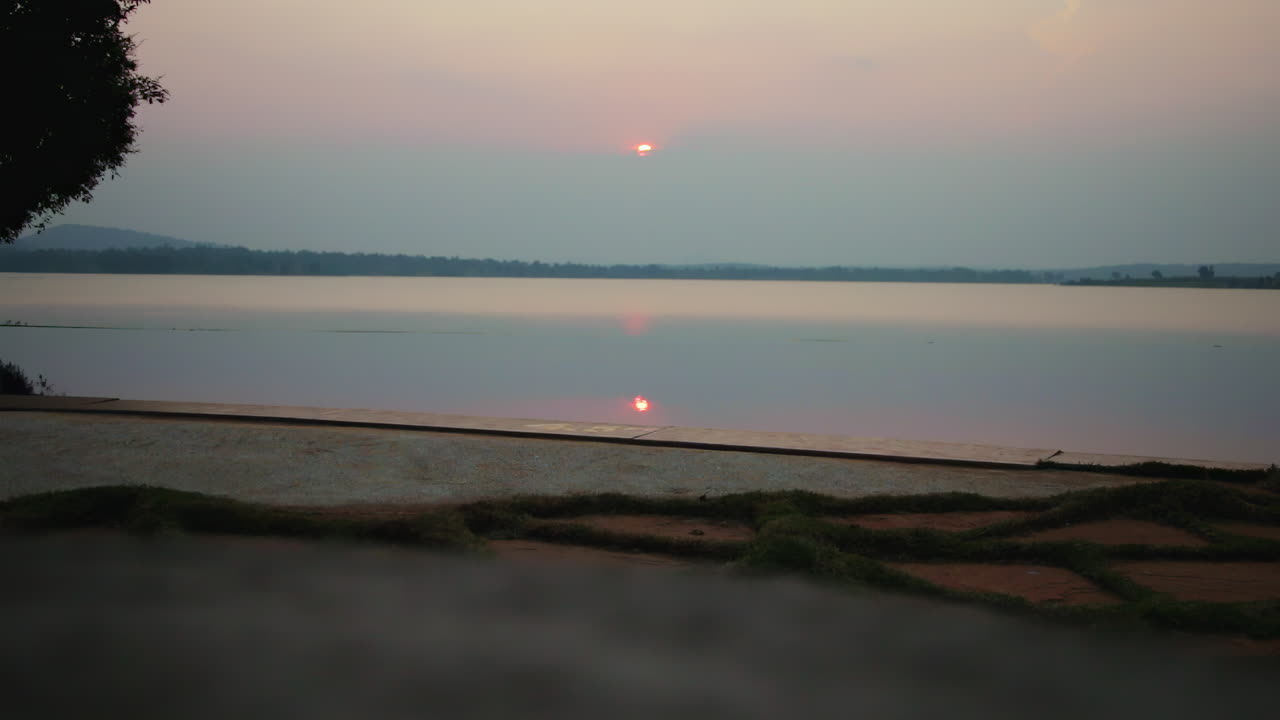 Timelapse sunset over infinity pool at Nagarahole forest Kabini river resort, peaceful and calm scene