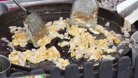 stir-fried egg with pork on a hotplate