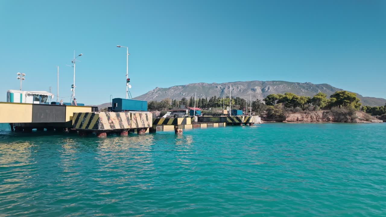 Corinth canal submersible road bridge raising from turquoise waters