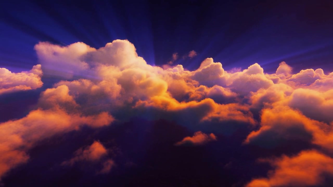 Aerial View of Golden Clouds at Sunset with Sun Rays