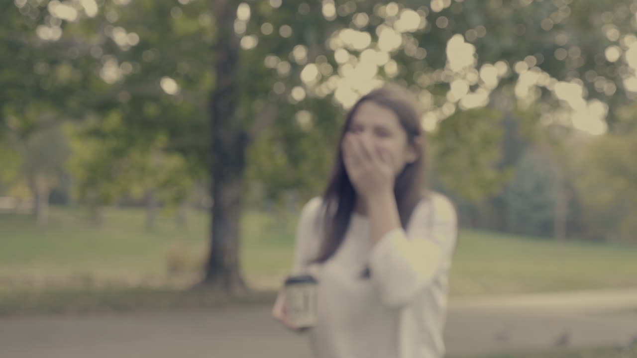 Woman laughing in park