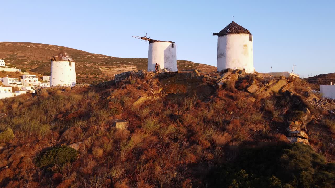 Aerial Orbit of Windmills in Vivlos Village at sunset, Naxos, Greece