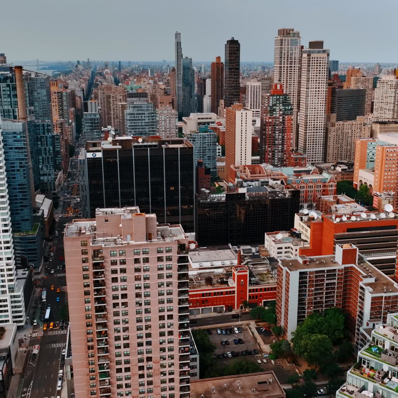 Beautiful and varied architecture of New York at daytime. Drone flying above the unusually designed buildings of metropolis