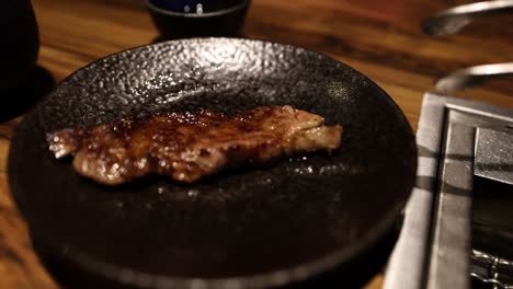 steak grilled, flipped, and served in a pan