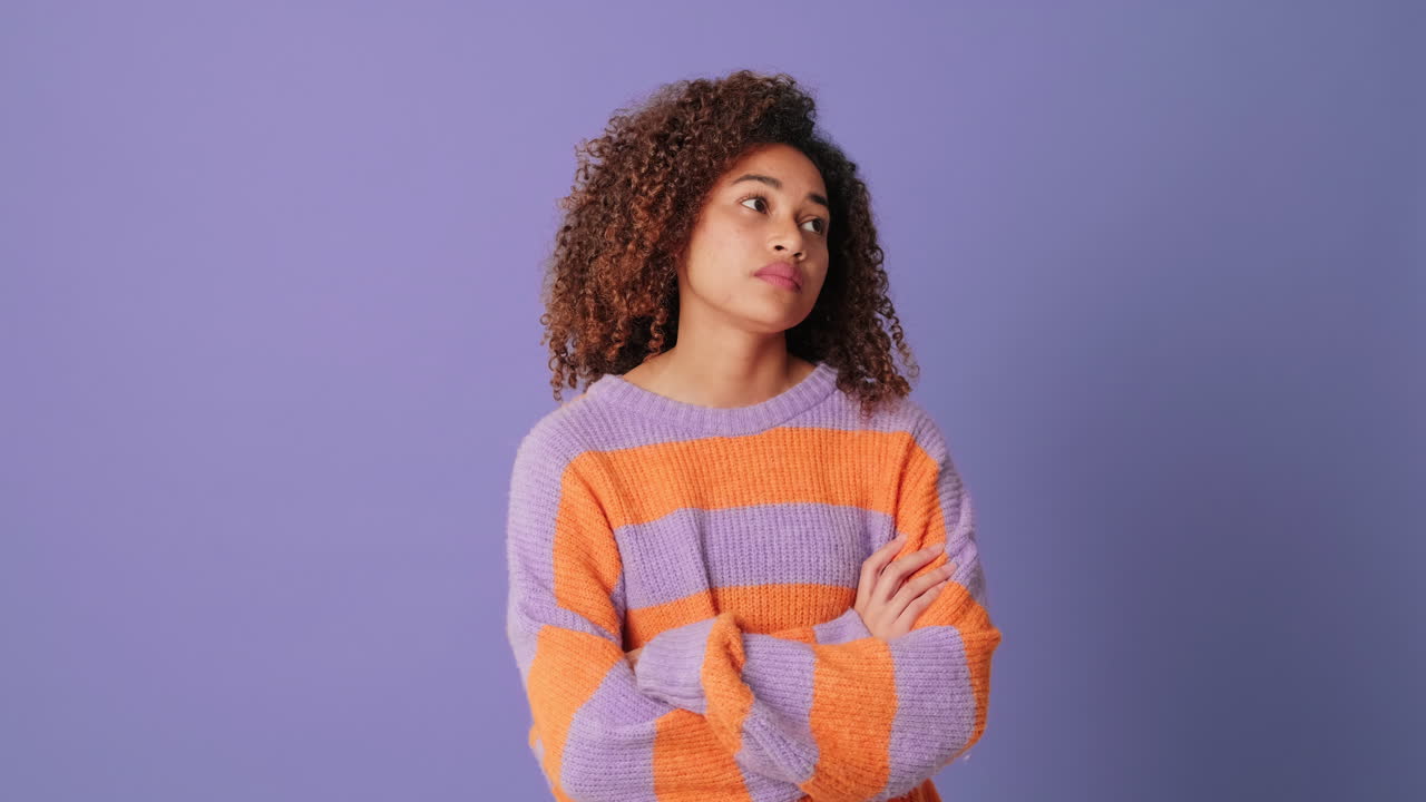 Thoughtful Young African American Woman Looking Around