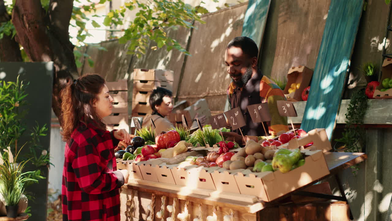 People shopping for fresh vegetables at a market stall