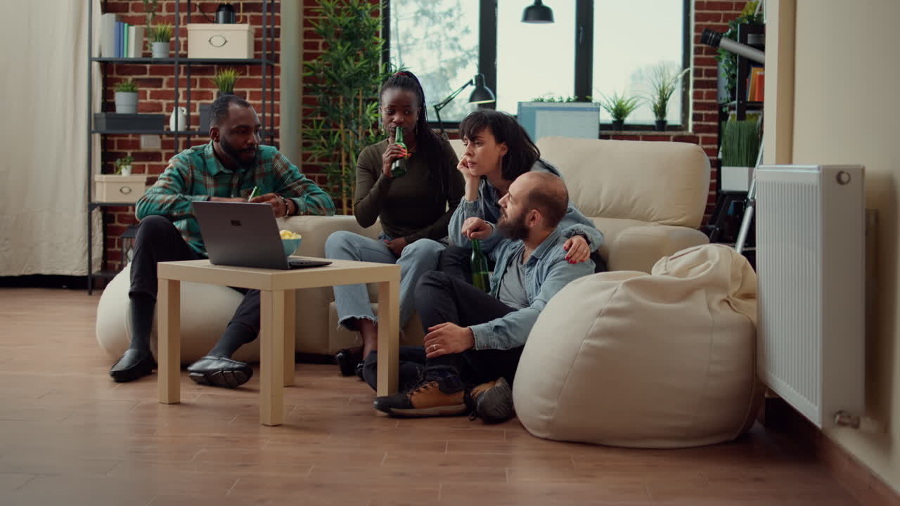 Multiethnic group of people having conversation and drinking beer