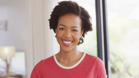 Video-of-happy-african-american-woman-looking-at-camera