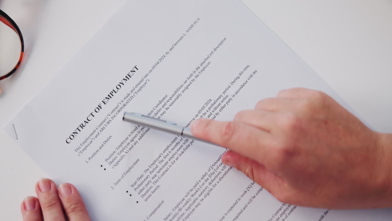 Employment Contract Being Reviewed and Signed