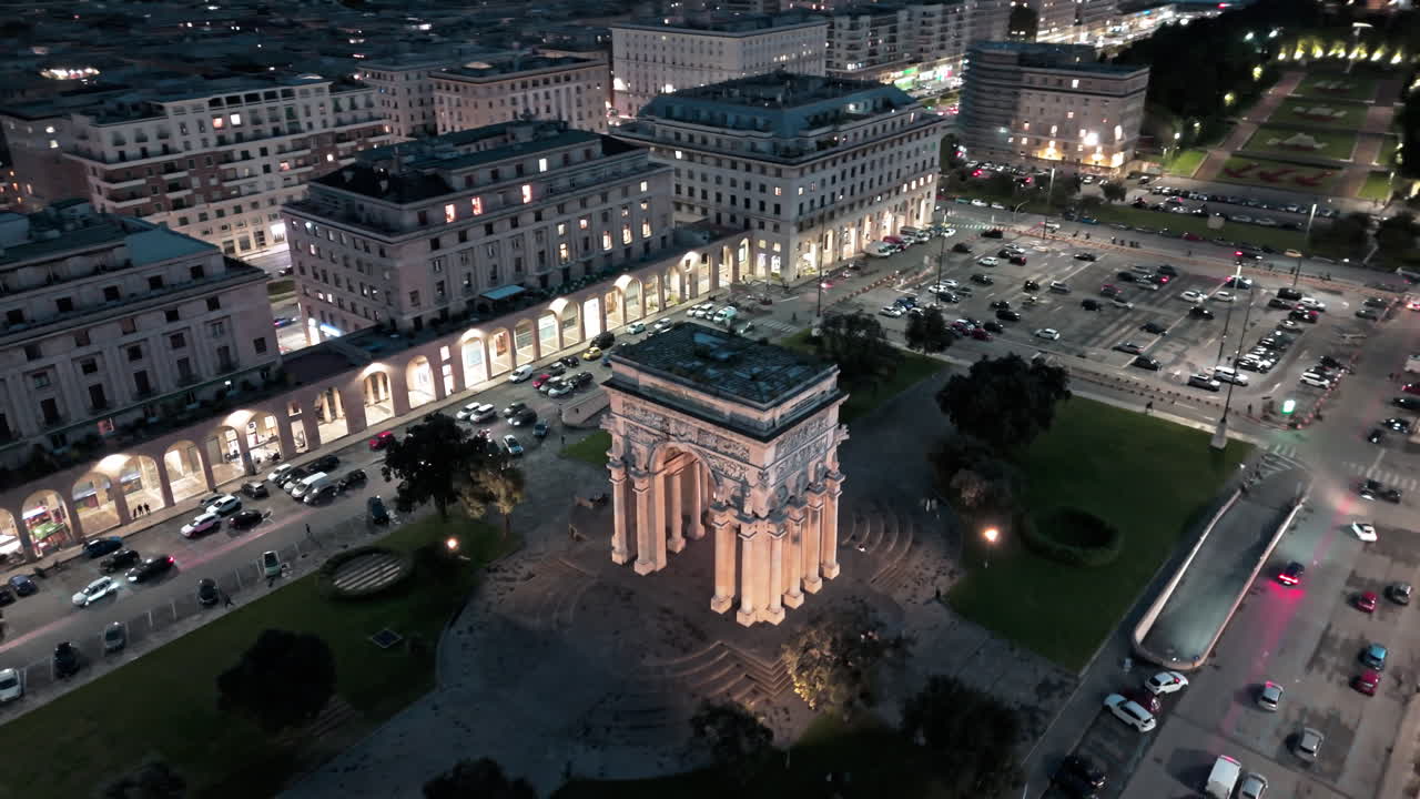 Night aerial view of Piazza della Vittoria and illuminated landmark Victory Arch