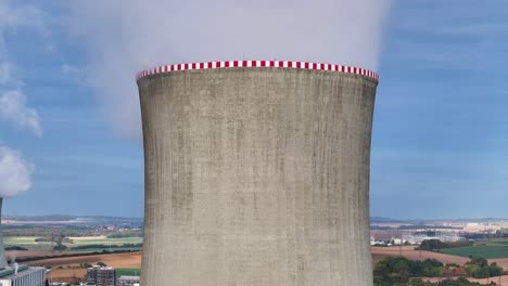 aerial reveal of multiple nuclear power plant facility cooling towers